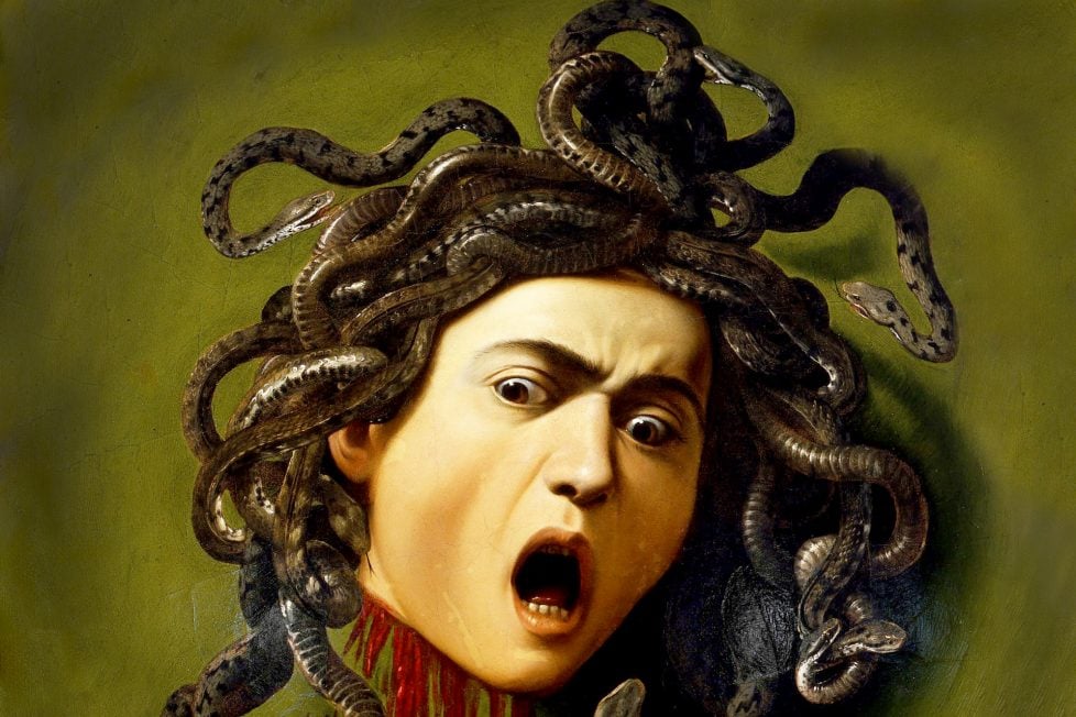 The severed head of Medusa, a woman with snake hair, is the subject of this painting. She looks terrified and agonized, with blood gushing from her cut neck. Her eyes and mouth are wide open, as if she is screaming. The snakes on her head are different colors of green, brown, and gray, and they coil and slither around her. The painting has an olive-green background. The painting depicts a scene from a Greek myth, where Perseus, a hero, slayed Medusa by using a shield that reflected her gaze, which could turn anyone to stone. The painter, Caravaggio, also made this painting a self-portrait, by using his own face as the model for Medusa.