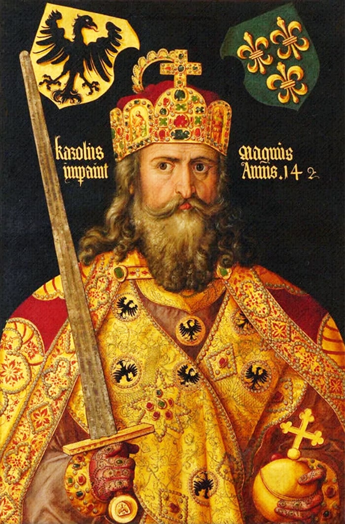 A painting of Charlemagne, also known as Charles the Great, the emperor of the Franks. The painting is by Albrecht Dürer, a German painter and printmaker of the Renaissance period. The painting was made in 1512 CE and is currently in the Germanisches Nationalmuseum in Nuremberg, Germany. The painting shows Charlemagne in a robe with red and gold embroidery, decorated with black eagles. He is wearing a crown with a red and gold mantle, adorned with pearls and precious stones. He is holding a sword in his right hand and a scepter in his left hand. The background is black with a gold eagle and a green shield with a gold fleur-de-lis. The text on the left side of the image reads “Karolis impant” and the text on the right side reads “magnus Anno 14 2”. The painting depicts Charlemagne as a powerful and majestic ruler, with symbols of his authority and his imperial lineage.