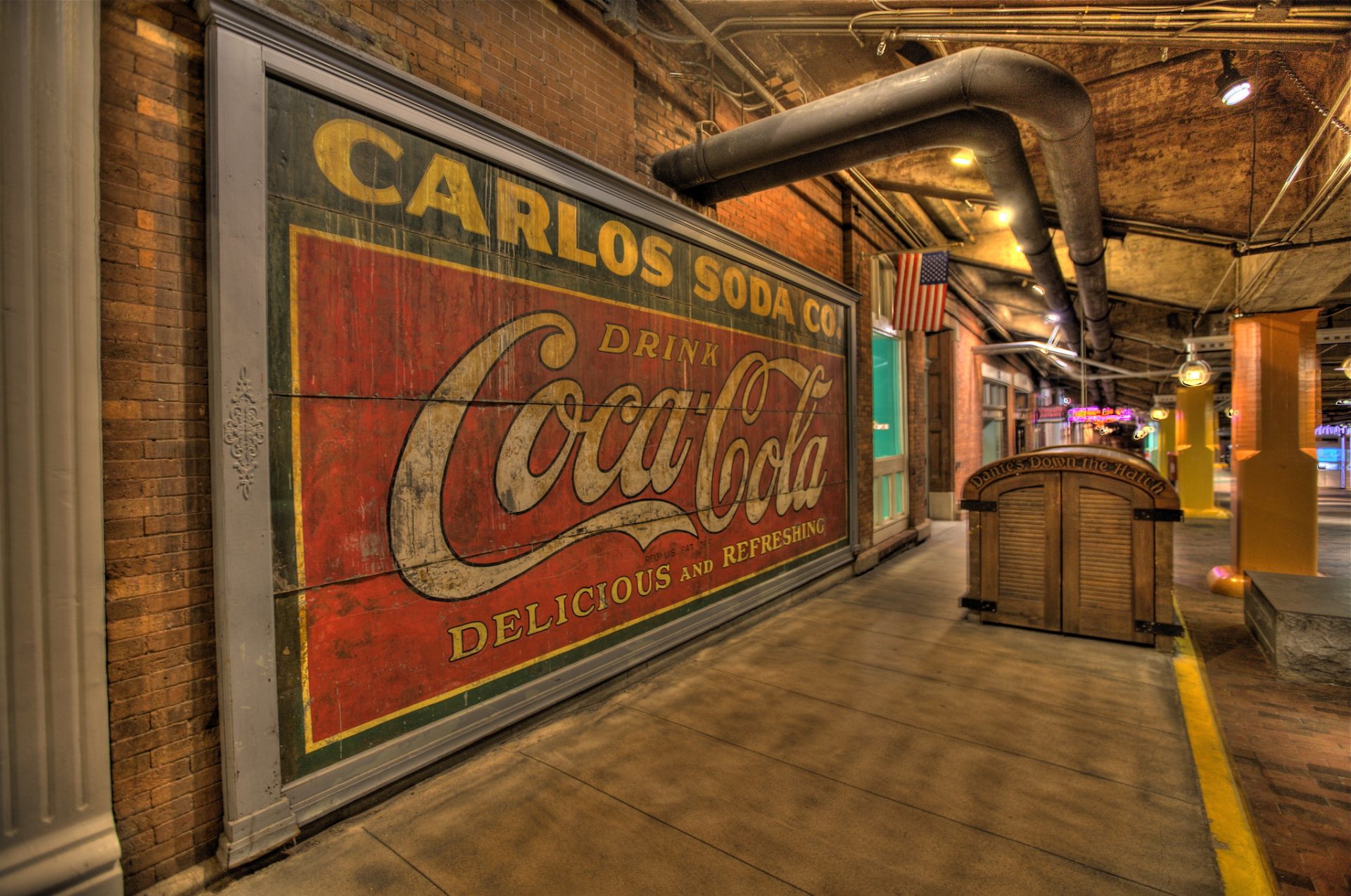A large mural of the Coca Cola sign at the Atlanta Underground