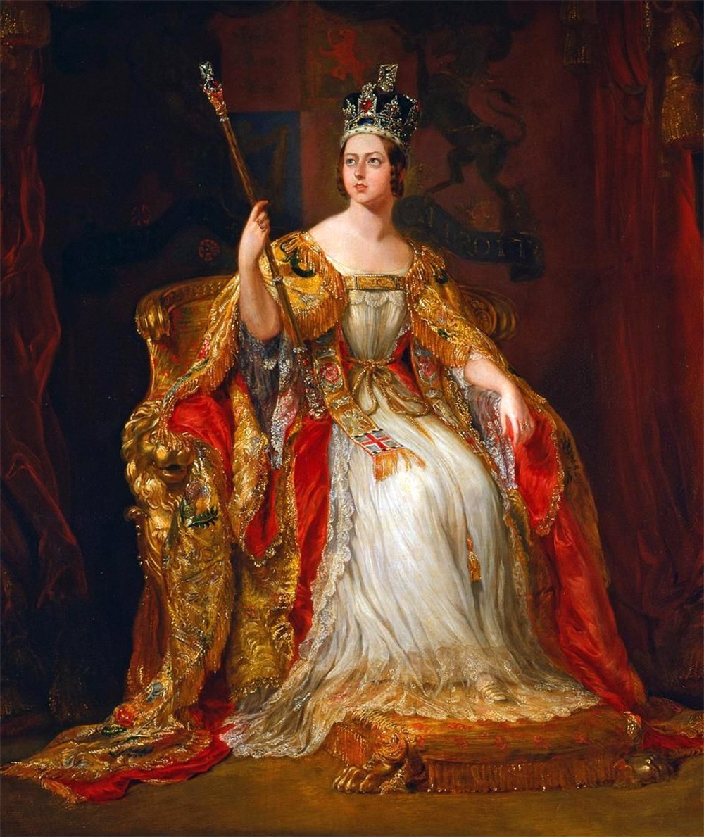 A painting of Queen Victoria in her coronation robes, sitting on a throne with a red curtain and a coat of arms behind her. She holds a scepter in her right hand. She wears a crown on her head.