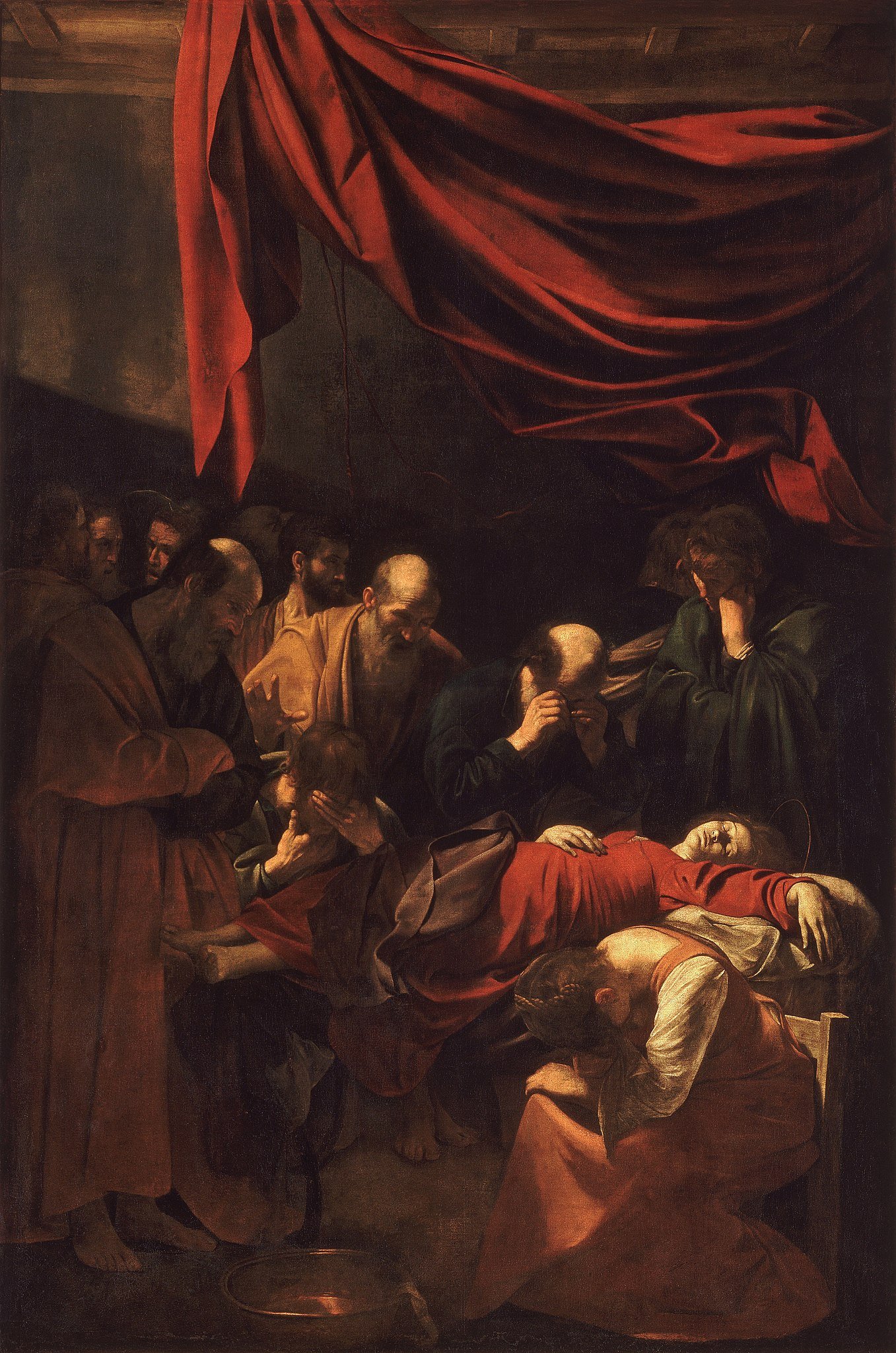 Caravaggio's painting presents a naturalistic portrayal of Mary in a red dress, capturing the raw realism of her mortal remains. Traditional indications of her holiness are abandoned.