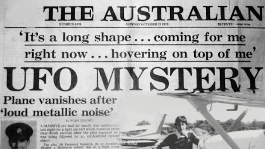 A photograph of a newspaper article with a black and white photograph of a man standing next to an airplane. The headline of the article reads "UFO mystery"