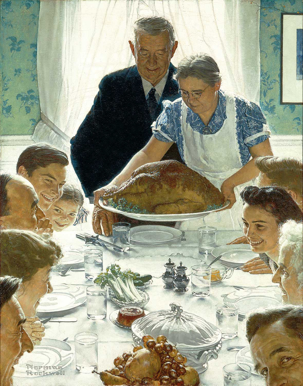 Iconic painting from 1943 by Norman Rockwell, titled “Freedom from Want”, depicting a multi-generational family gathered around a dining table at Thanksgiving, with the grandmother placing a large, cooked turkey on the table.