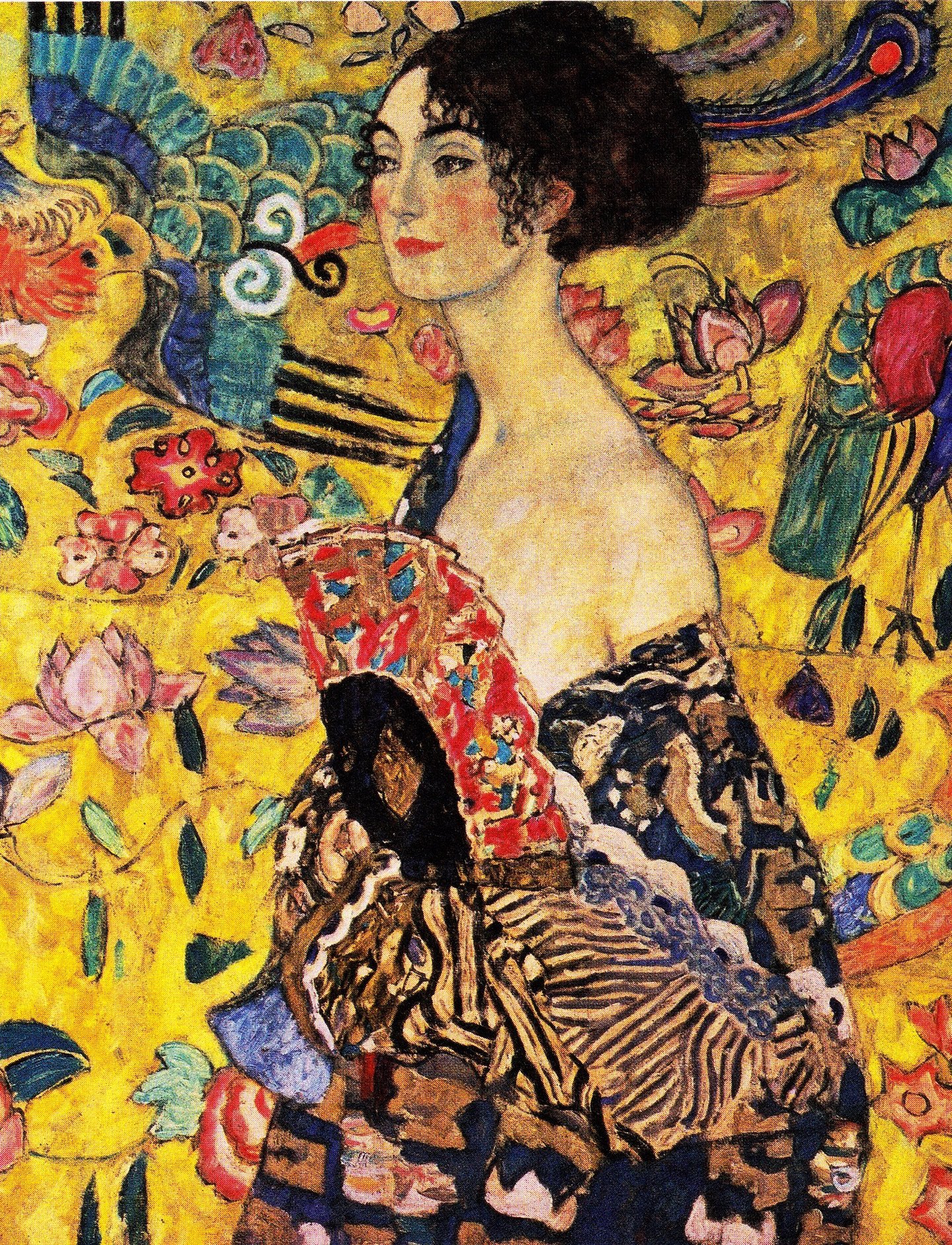 The image is a painting of a woman in a black and gold dress with a fan in her hand. She is standing in front of a yellow background with a pattern of flowers and leaves. The woman has a relaxed expression on her face and is holding the fan in her right hand. The painting is in the style of the Art Nouveau movement.