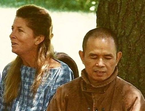 A photograph of Joan Halifax and Thich Nhat Hanh at The Ojai Foundation, next to a tree.