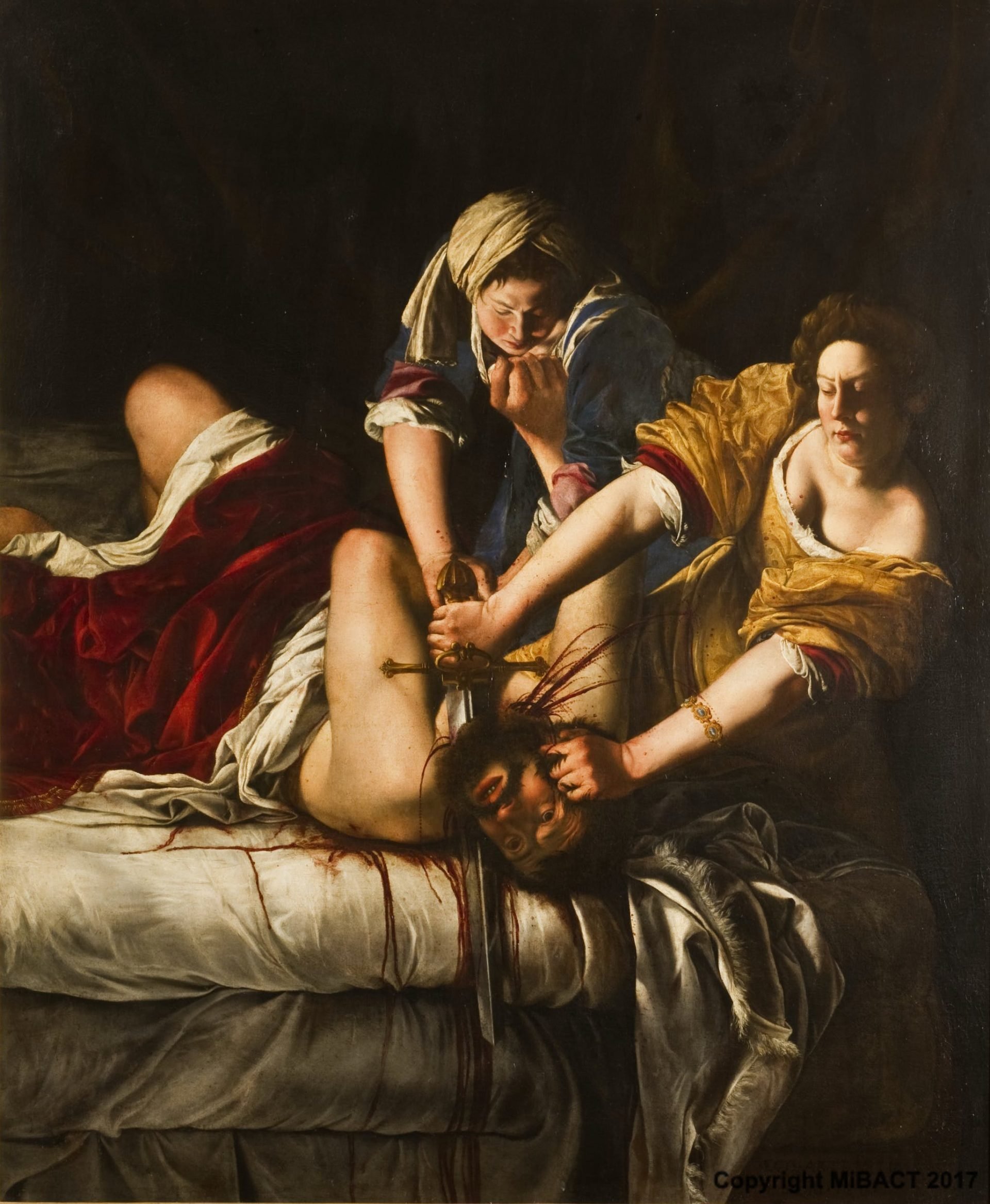 Artemisia Gentileschi portrays the moment when Holofernes is being decapitated by Judith.