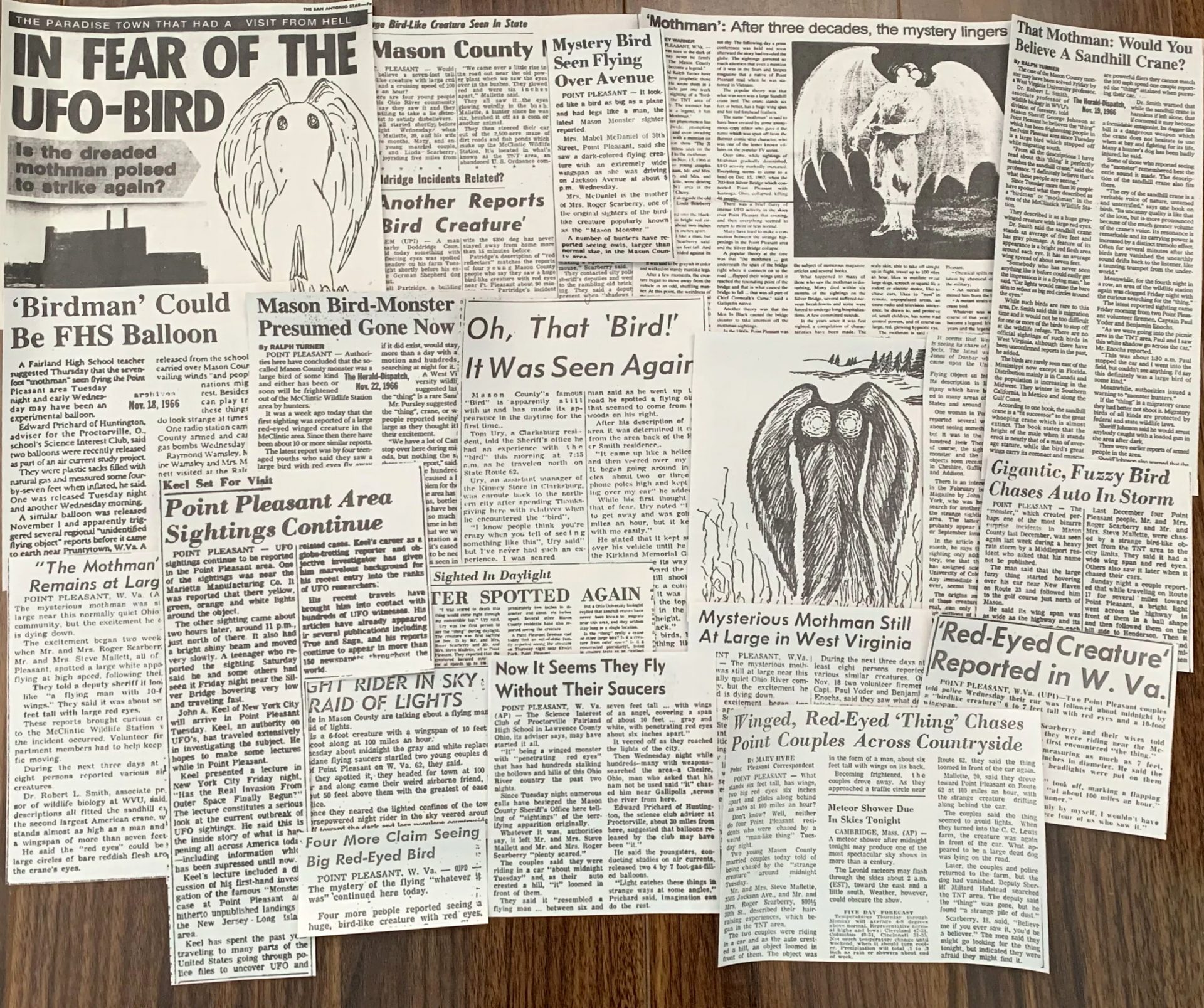 A collage of newspaper clippings about the Mothman sightings in West Virginia in the 1960s. The clippings are black and white and have different headlines, illustrations, and stories about the mysterious creature that was reported to have red eyes, wings, and a humanoid shape. The clippings are arranged in a random and overlapping manner.