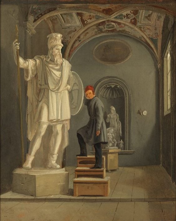 A painting of a tall statue of Odin with its sculptor next to it.