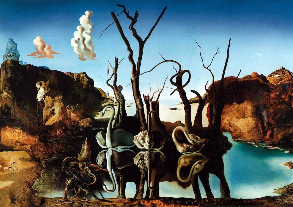 A surrealist painting by Salvador Dali titled “Swans Reflecting Elephants” depicting three swans in a lake, their reflections in the water forming the shape of elephants. The background is a rocky landscape with a blue sky and a red horizon. The foreground is a barren tree with twisted branches and a sculpture of a human figure with a snail on its head. The painting is known for its use of the double image technique, where one object is depicted as another.