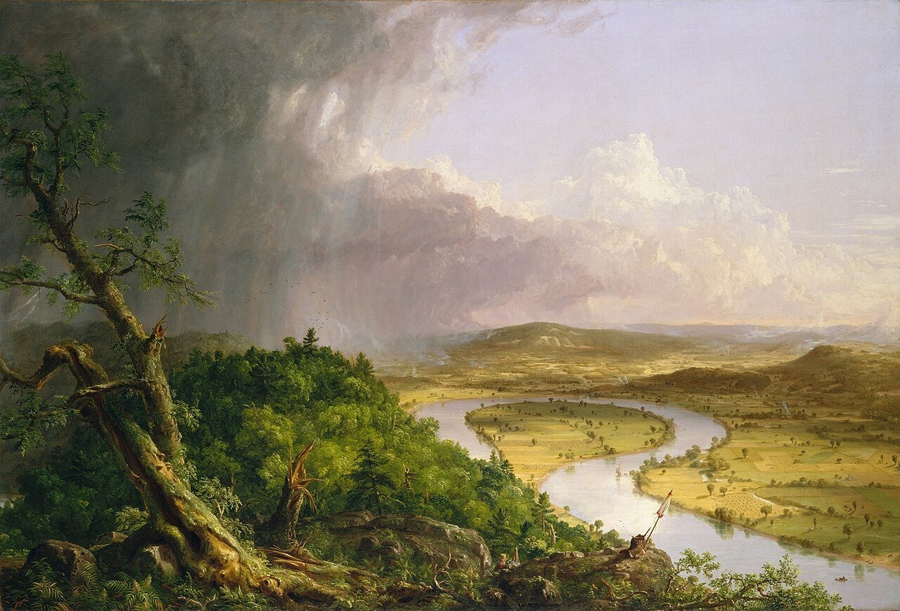 A richly detailed painting, titled “The Oxbow” by Thomas Cole, depicting the Connecticut River Valley's lush landscape after a thunderstorm. The left side illustrates untamed, storm-laden wilderness with massive trees and rugged cliffs. The right displays a serene pastoral scene, showing a peaceful river curving like an “oxbow” surrounded by cultivated land with tiny settlements. A small figure of the artist himself can be seen painting the landscape from a promontory. The contrasting wilderness and civilization are clearly distinguished, with dark, challenging clouds giving way to calm, clear skies.