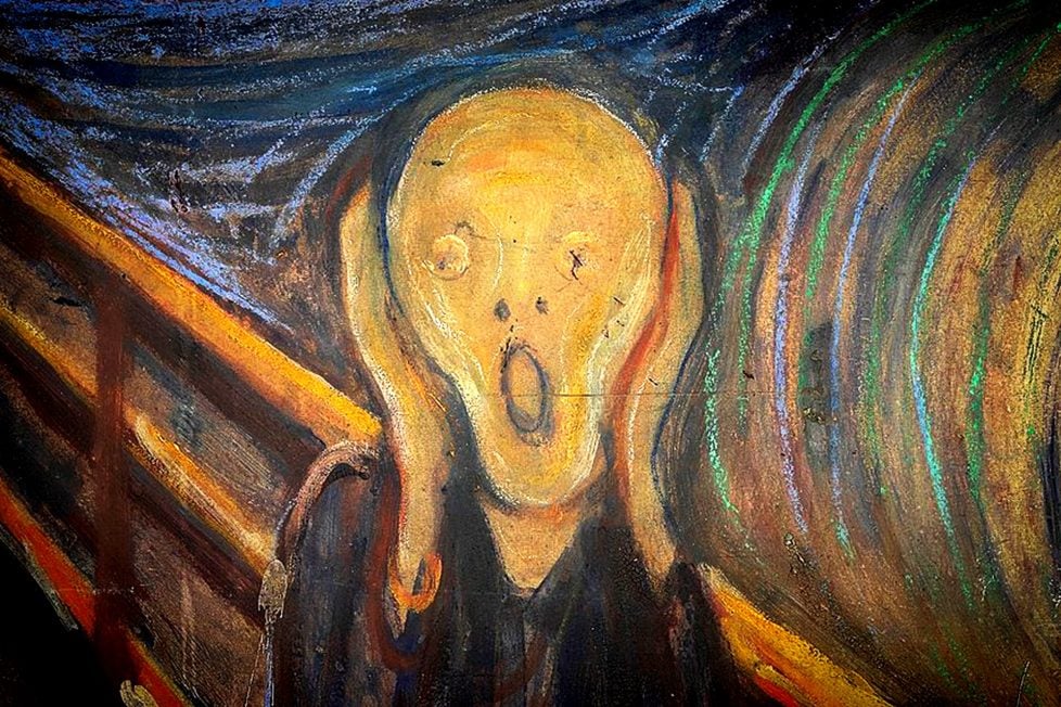 The image is a crop of a painting of the famous painting, The Scream by Edvard Munch. The painting depicts a figure with an agonized expression, holding its head and opening its mouth in a scream. The figure is set against a backdrop of a turbulent and colorful sky. The painting is considered one of the most famous and influential works of art of the 20th century.