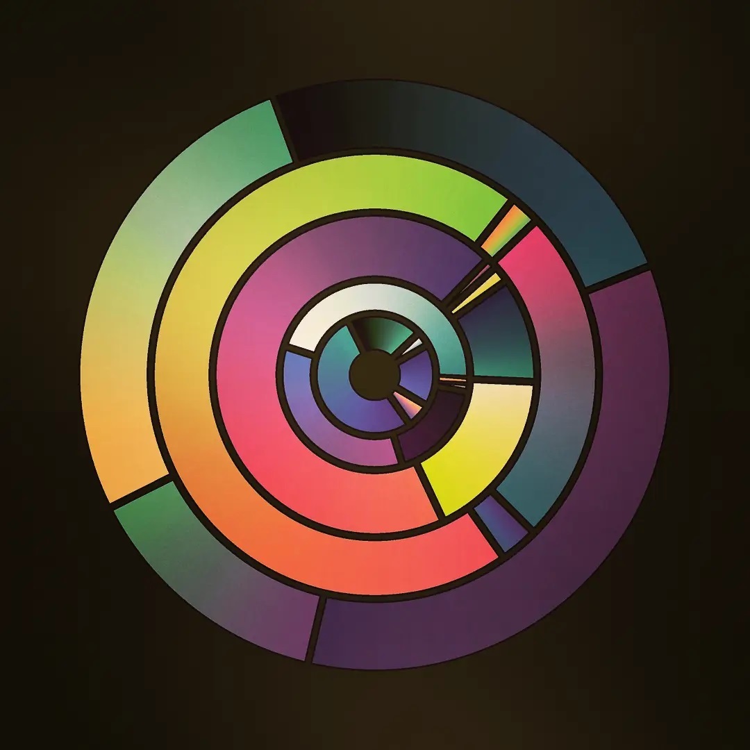 Multi-colored circles within a circle on a dark background.