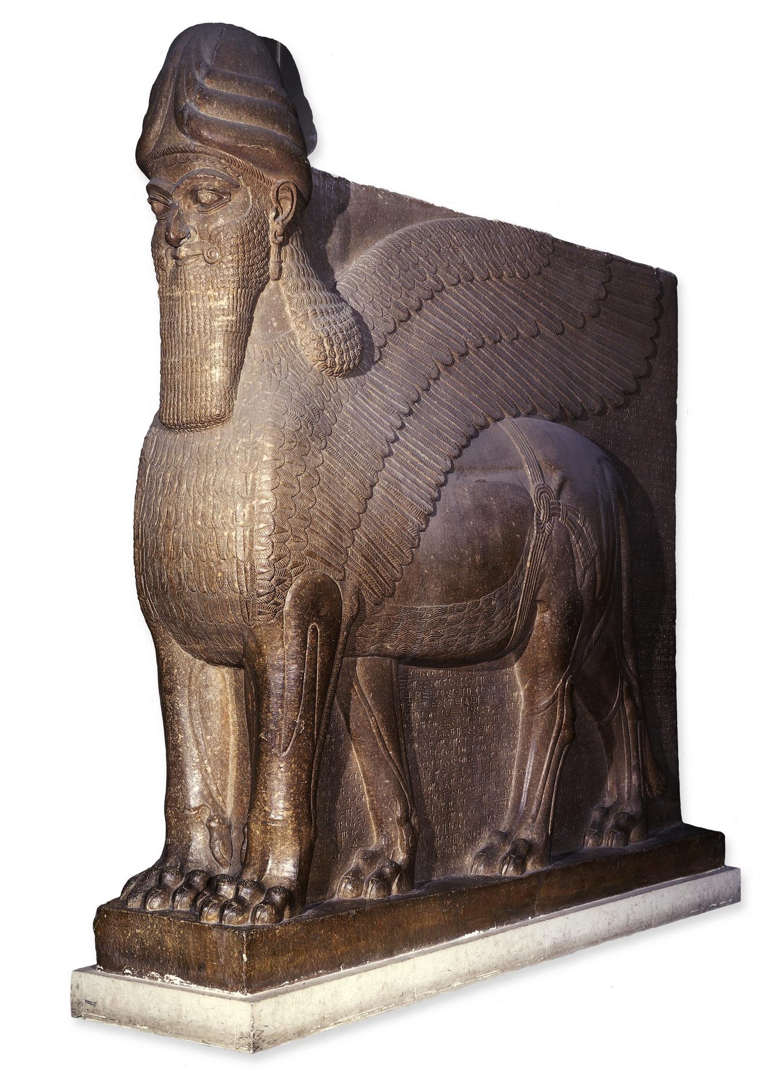 Gypsum statue; human headed winged lion; one of a pair that flanked the doorway of the throne room of the North West palace of Ashurnasirpal in Nimrud; helped provide magical protection; the five legs suggest that the lion was intended to be viewed from the front or side and not at an intermediate angle.