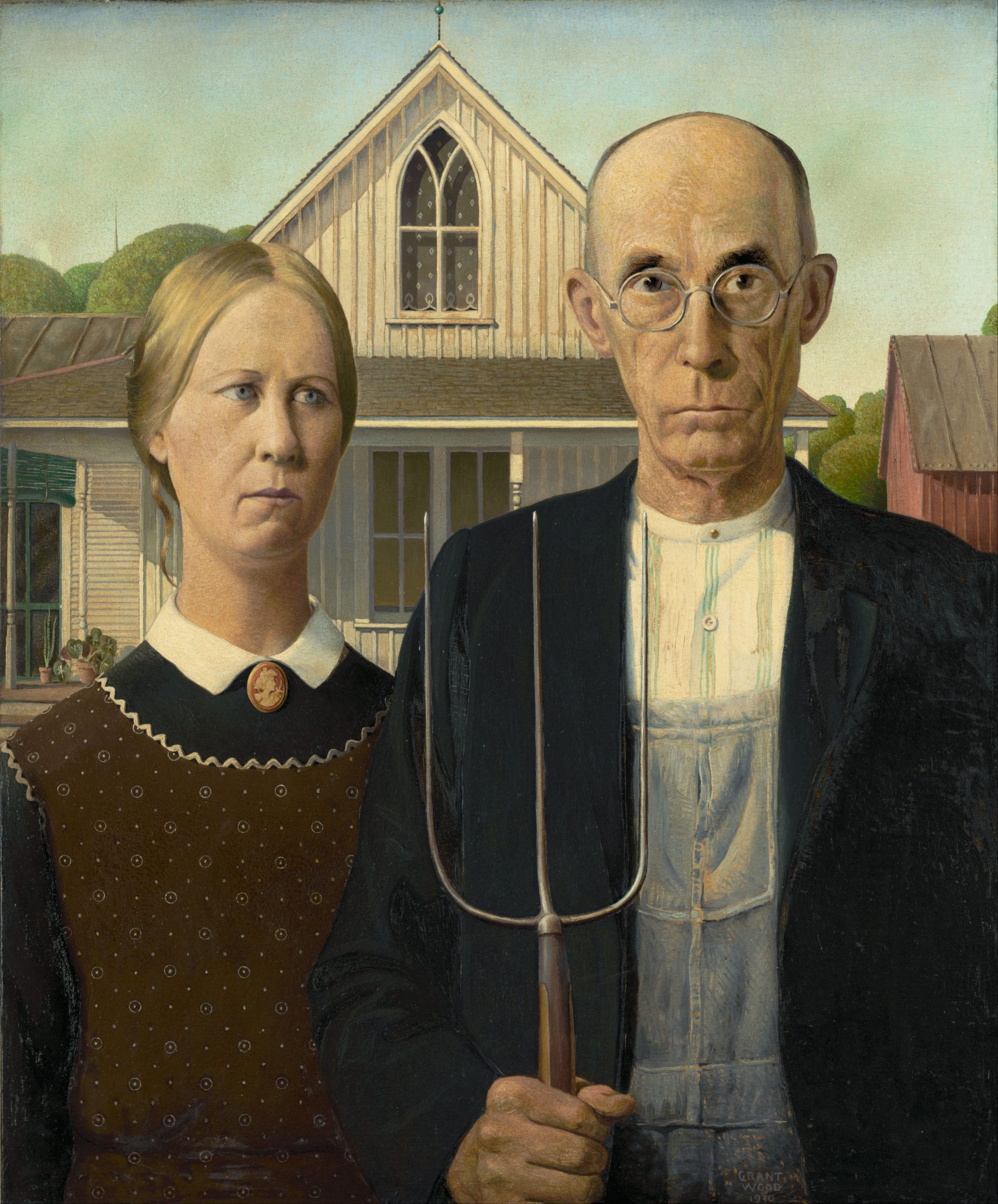 A stern-looking, middle-aged man stands on the right, dressed in overalls with a black jacket. He holds a long-handled pitchfork vertically, the prongs pointing upwards. Next to him on the left, a woman, presumed to be his daughter, wears a colonial print apron covering a dark dress, her eyes slightly averted to the right. Both figures embody the rural Midwest ethos of the time. Behind them, a white farmhouse with a distinctive Gothic window stands under a clear, bright sky, creating a stark contrast to the solemn expressions of the figures. The overall tone of the painting suggests a mix of resilience, austerity, and the American spirit in rural life.