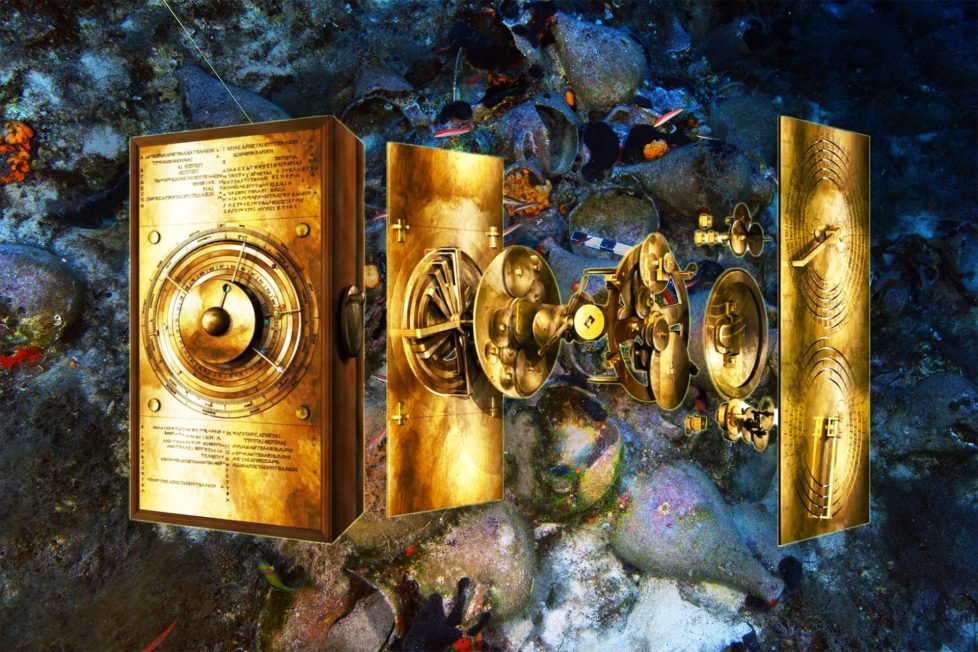 Photo realistic image of a computerized breakdown of the Antikythera Mechanism – golden mechanical device with gears and dials. In the background, an underwater photo of ancient amphora pots covered in coral and sea life, with striped fish swimming near them.