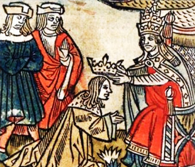 A medieval illustration of a coronation ceremony of Pepin the Short by St. Boniface in 751 . A St. Boniface in red robes holds a crown over the head of Pepin the Short in beige robes, who kneels in front of him. Behind them, several other people watch the scene.