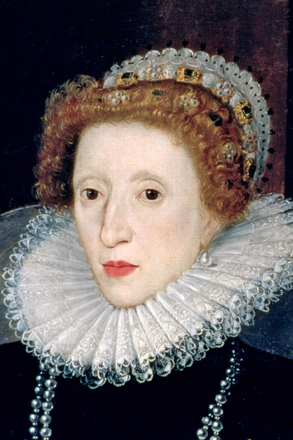 A portrait of Queen Elizabeth I. Her lips are red. she is wearing a dark dress a pearl necklace and a lace collar.