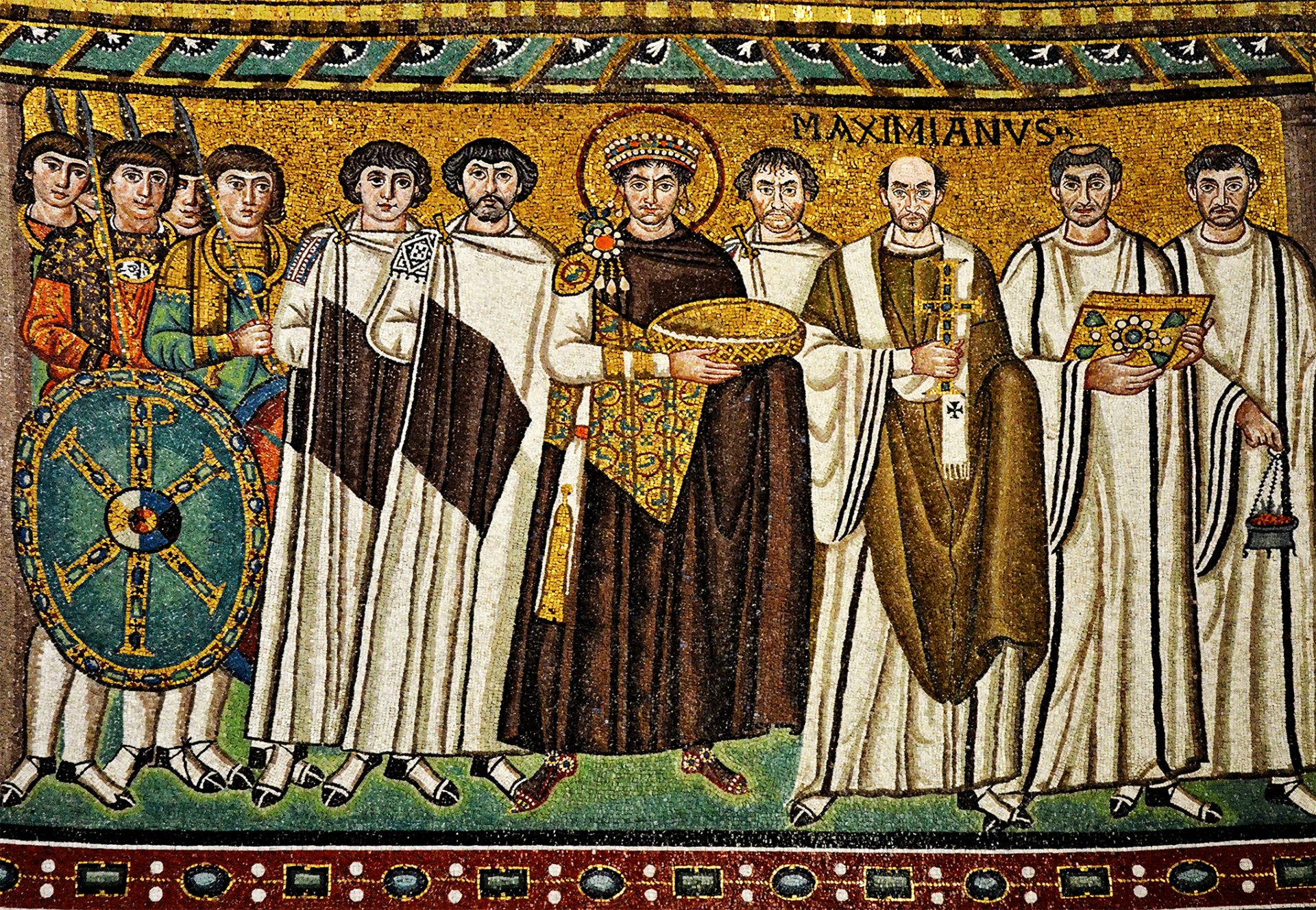 A mosaic from Basilica of San Vitale, Ravenna, Italy showing Emperor Justinian and his entourage including guards and clergymen.