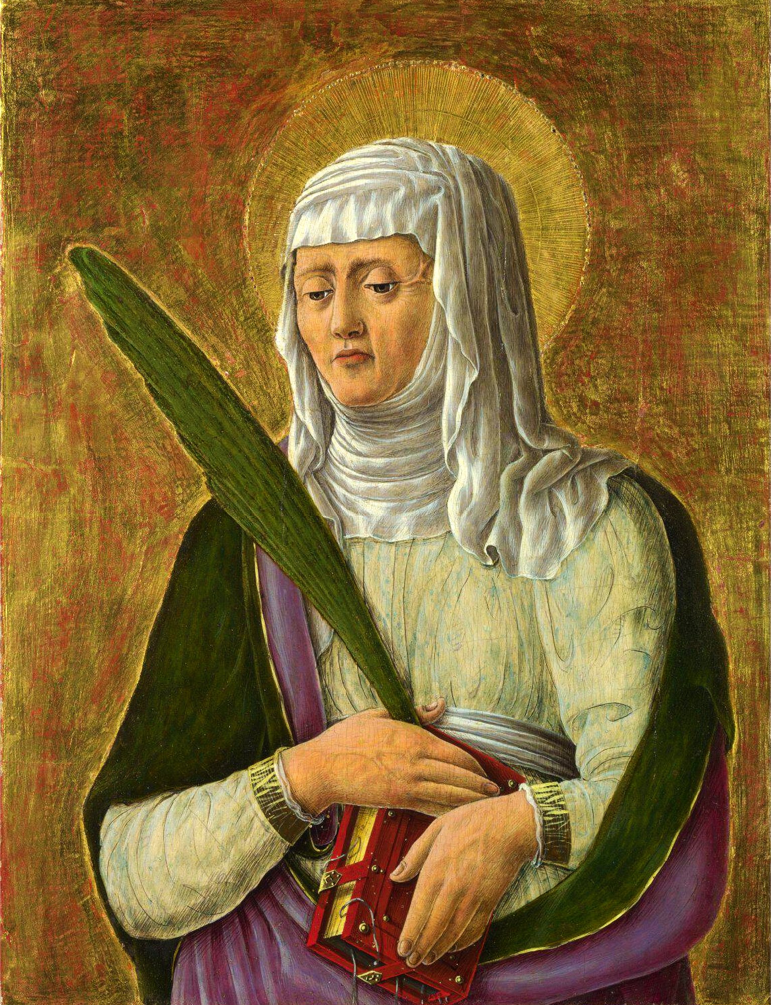 A painting of a female saint. The saint is wearing a white head covering and a purple robe. The saint is holding a green palm frond and a red book. The background is gold with a halo around the saint’s head.
