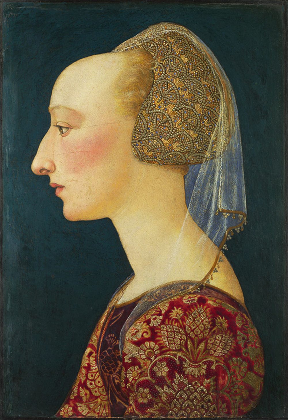 This is a painting of a woman with a headdress made of red and gold cloth. She has blonde hair collected in the headdress. Her forehead is naturally high, as if it's been plucked.
