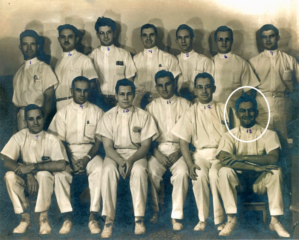 A black and white photo of a group of people in white uniforms. Héctor Pérez García in the bottom right corner is circled in white, indicating that he is the focus of the photo.