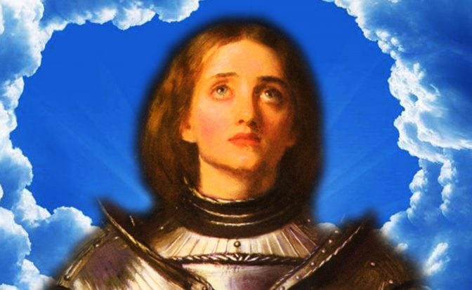 Joan of Arc in armor standing in front of a blue sky with clouds. The clouds form a circle around her head.