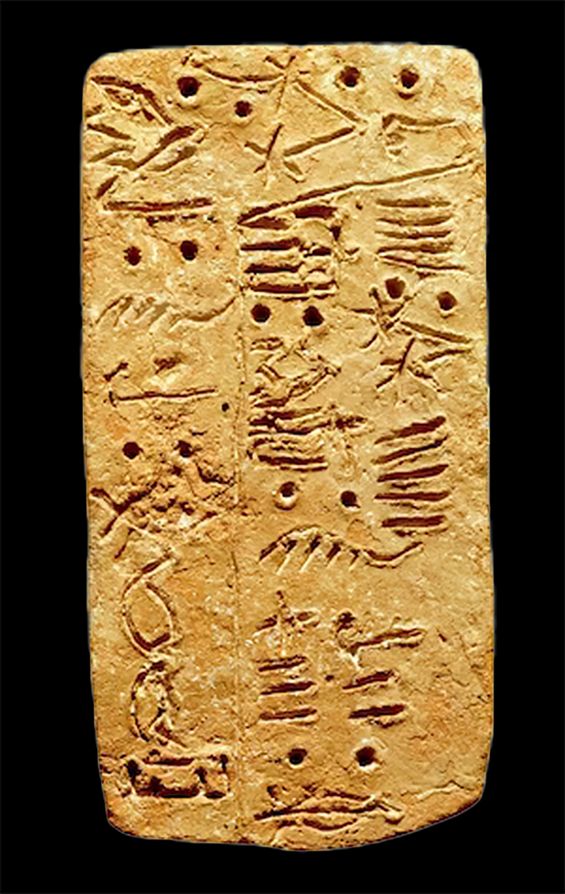 Linear A script etched into a clay tablet.