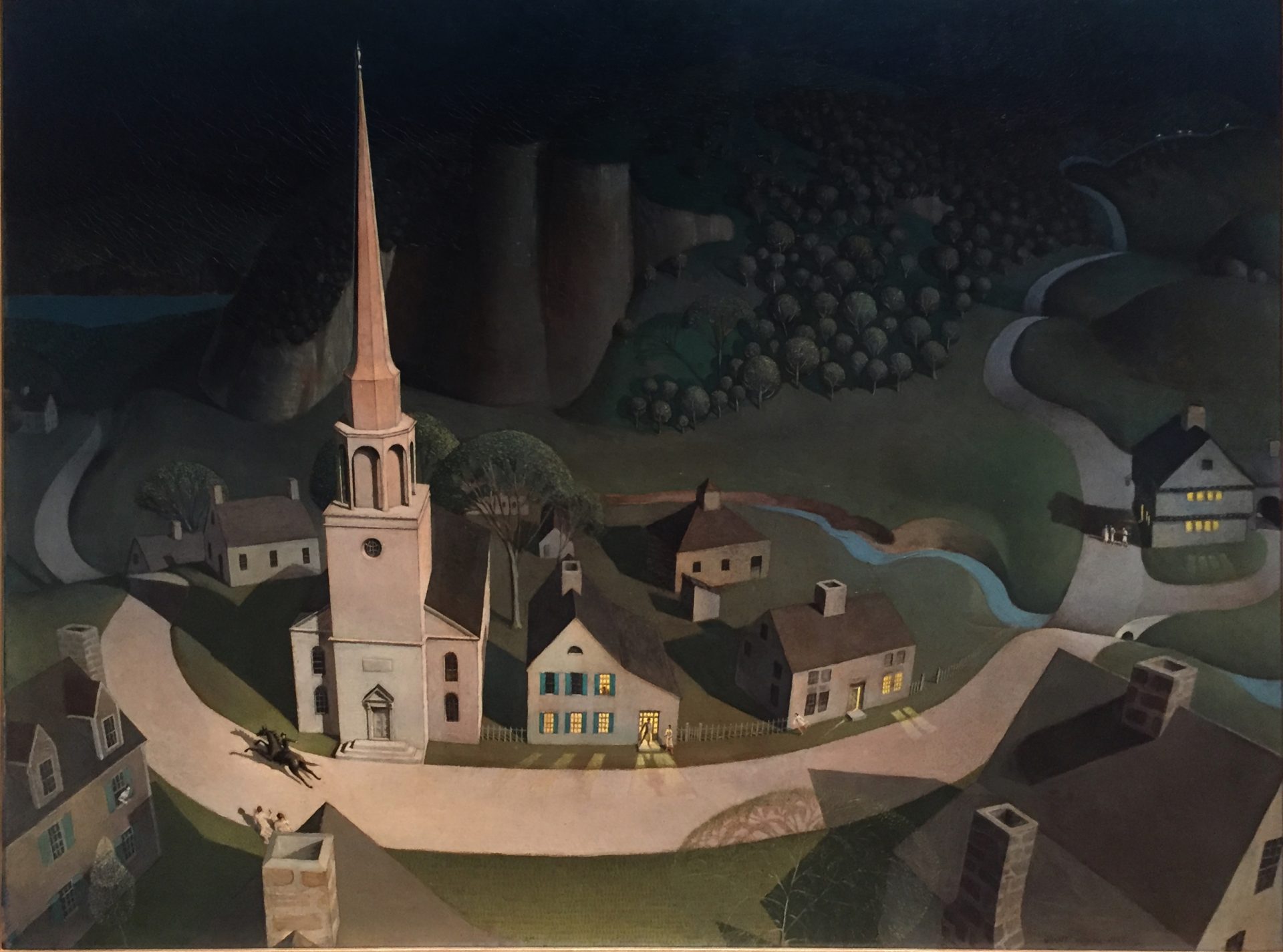 A dramatic aerial view of a small New England town at night, featuring Paul Revere on horseback galloping through the narrow, winding streets, presumably alerting the residents of the incoming British forces. The houses and streets are simplified and geometrical, almost toy-like, rendered in a rich palette of blues and greens under the moonlight. The lighted windows of the houses punctuate the scene with warm, inviting spots of yellow. The church in the center of the town is a significant focal point. The painting stylizes and romanticizes the historic event with a sense of whimsy and folklore.