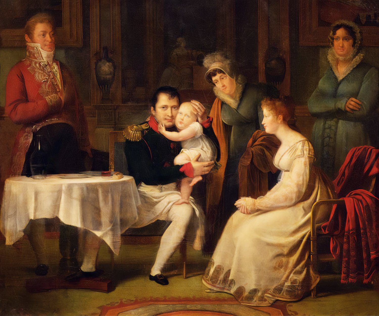 Intimate portrait depicting Napoleon I seated, lovingly holding his son, the King of Rome, while his wife, Marie Louise, sits nearby gazing affectionately at the child. To the left, a dignified official in a red military uniform stands near a table, observing the tender family moment. To the right, two female attendants look on, one with a caring expression and the other more stoic.
