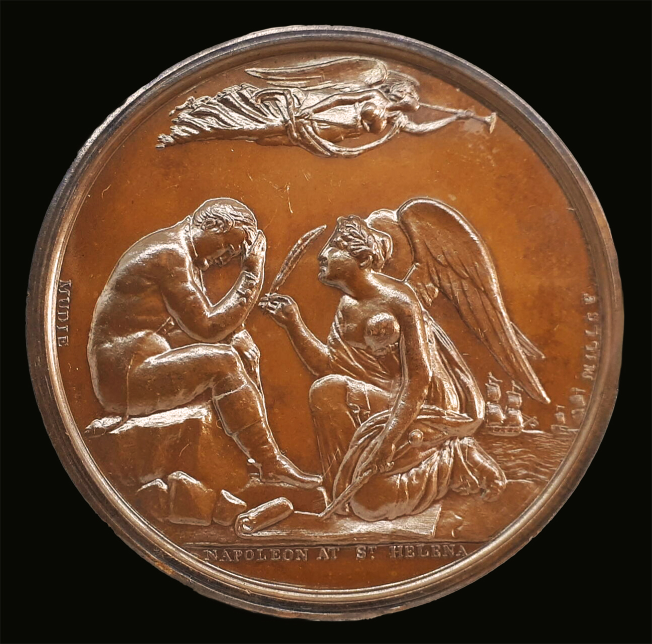 A bronze medallion depicting a despondent Napoleon, seated in a thoughtful pose, is reminded of his duties by History kneeling before him. The inscription 'Napoleon at St. Helena' is engraved at the bottom.