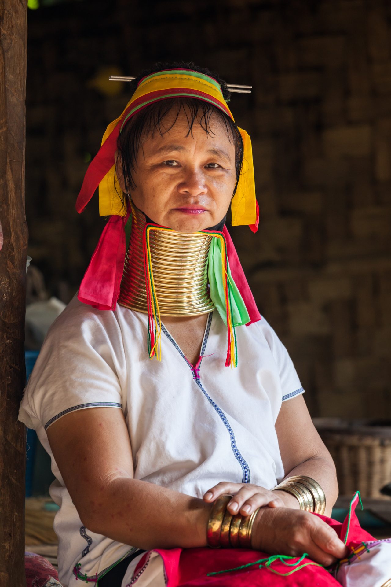This image showcases a Kayan (Padaung) woman in Thailand, highlighting her characteristic neck rings.