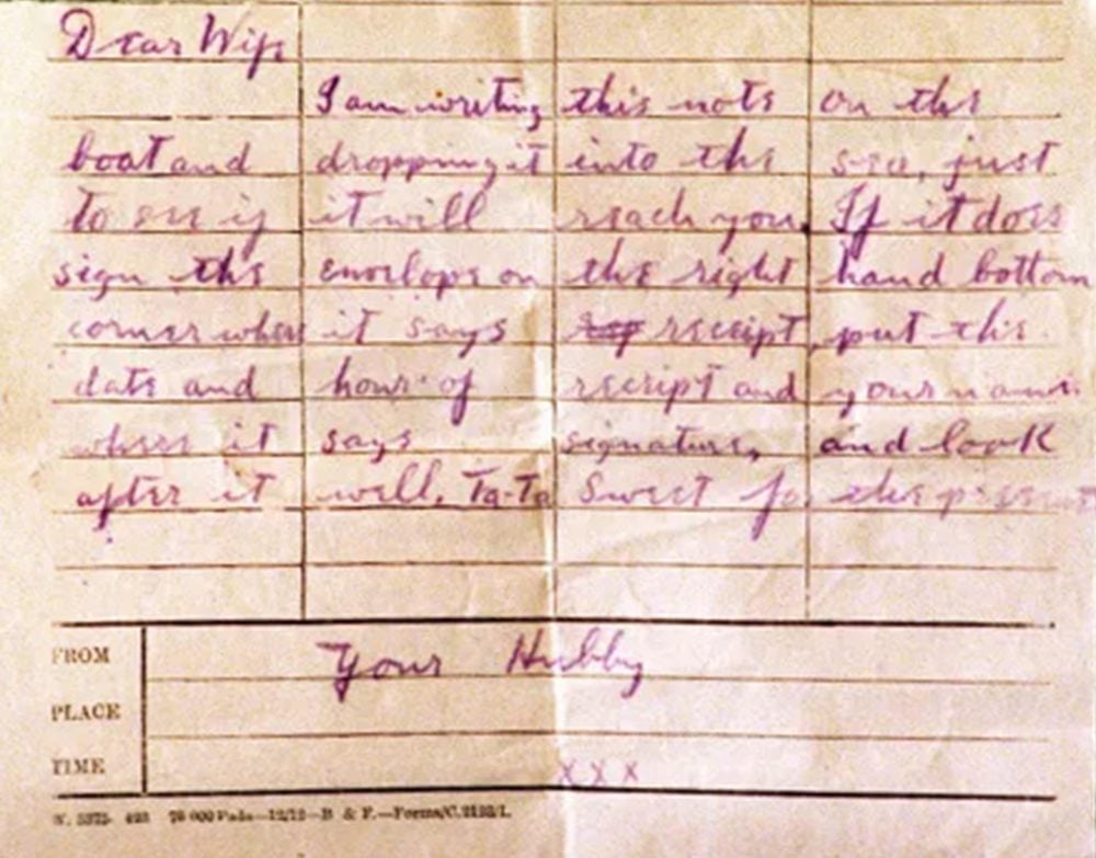 A photograph of a note hand-written on yellowing telegram paper.