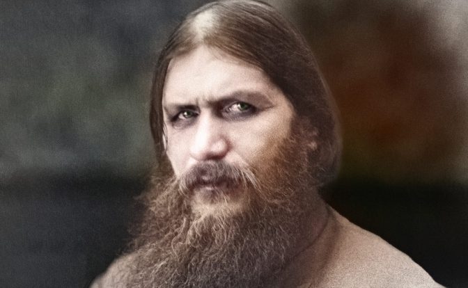 A photograph of Grigori Rasputin. He has deep set eyes, dark circles under them. His beard is long and unruly.