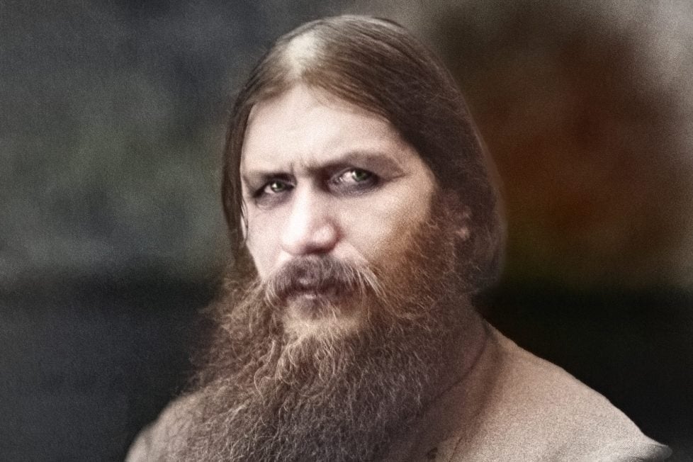 A photograph of Grigori Rasputin. He has deep set eyes, dark circles under them. His beard is long and unruly.