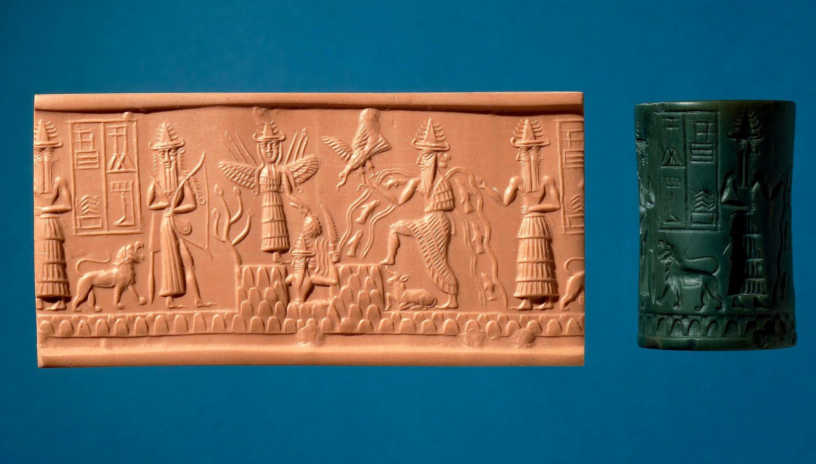 Concave greenstone cylinder seal featuring various deities in horned headdresses: a hunting god with bow and quiver, winged Ishtar with weapons and a bunch of dates, emerging sun-god Shamash with a blade, and water god Ea interacting with an eagle. Additional elements include mountains, streams, fish, a resting bull, and two-faced attendant Usimu.