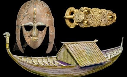 Three ancient artifacts on a black background: a helmet, a gold belt buckle with intricate designs, and a model of a purple and gold boat with a thatched roof.