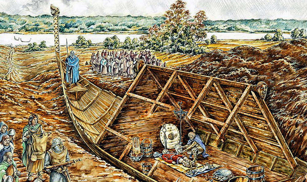 An illustration of a group of people gathered around a large wooden boat that has been dragged away from a riverbank. Inside the boat, we see a burial site of a king surrounded by favious objects, such as a shield, a sword and vessel.The background shows a river and a forested area.
