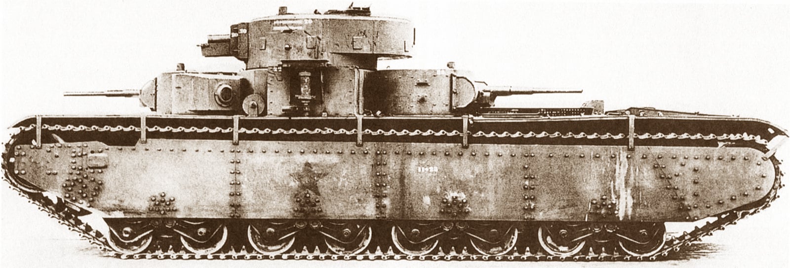 A black and white image of a Soviet T-35 heavy tank with a large turret in profile on a white background.