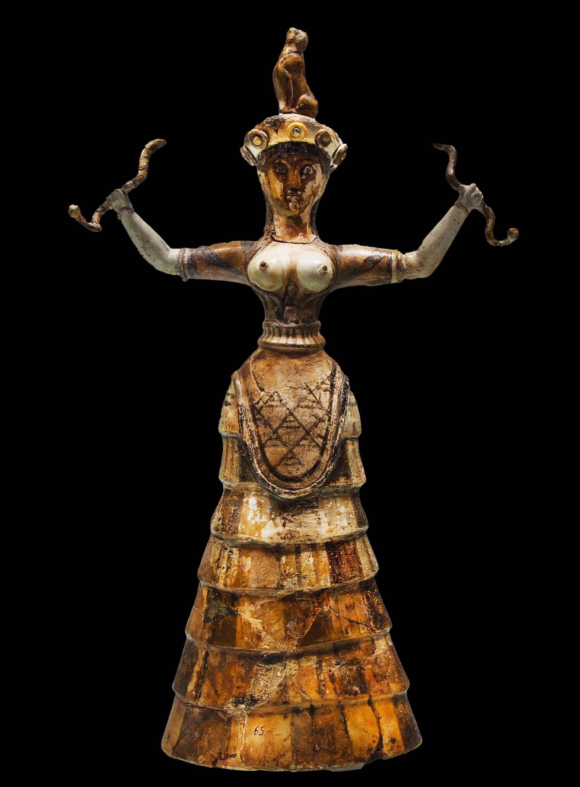 Image of the Minoan Snake Goddess. The deity is bare-breasted with a pronounced headdress and a flowing skirt. She confidently holds a snake in each hand, symbolizing fertility, regeneration, and wisdom, consistent with Near and Middle East Bronze Age beliefs.