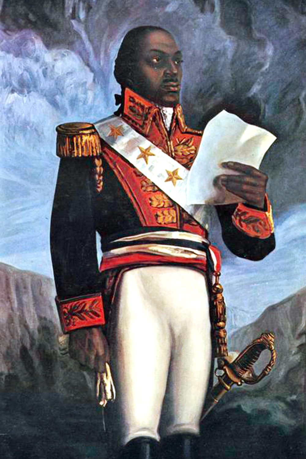 A portrait of Toussaint Louverture. He is wearing a french military uniform and a sash with three large stars on it. He has a sword hanging from his side. He is holding up a piece of paper in his left hand and white gloves in his right hand. The backdrop is a stormy sky and mountains.