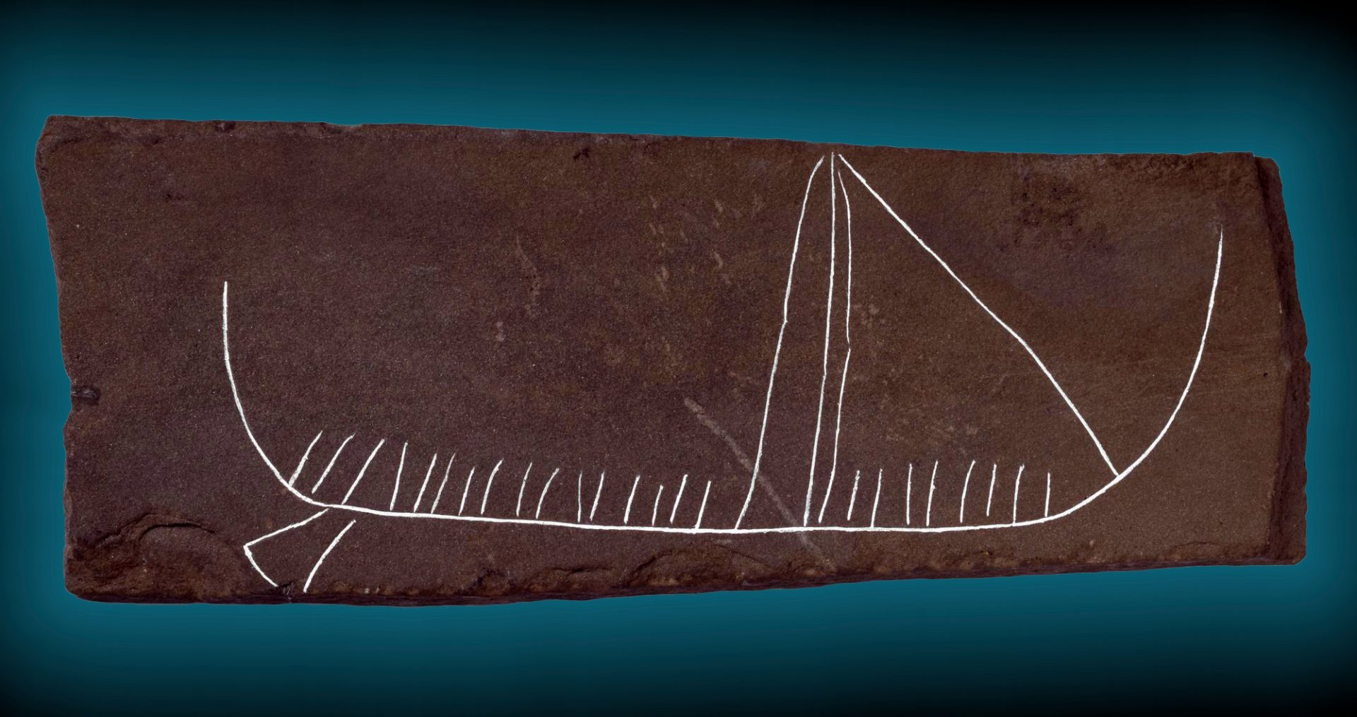 A detailed carving on slate depicting a Viking ship from the period 800 - 1100 AD, discovered in Jarlshof, Shetland, Scotland.