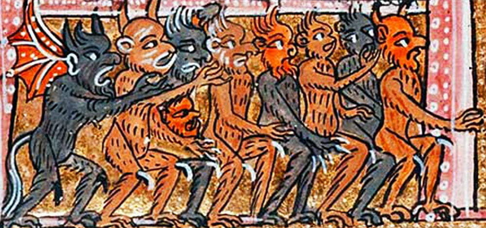 An image of a medieval manuscript illustration of a group of devils. The first figure on the left is a black dog-like creature with wings. The other figures are orange monkeys or apes. The background is red with a gold border.