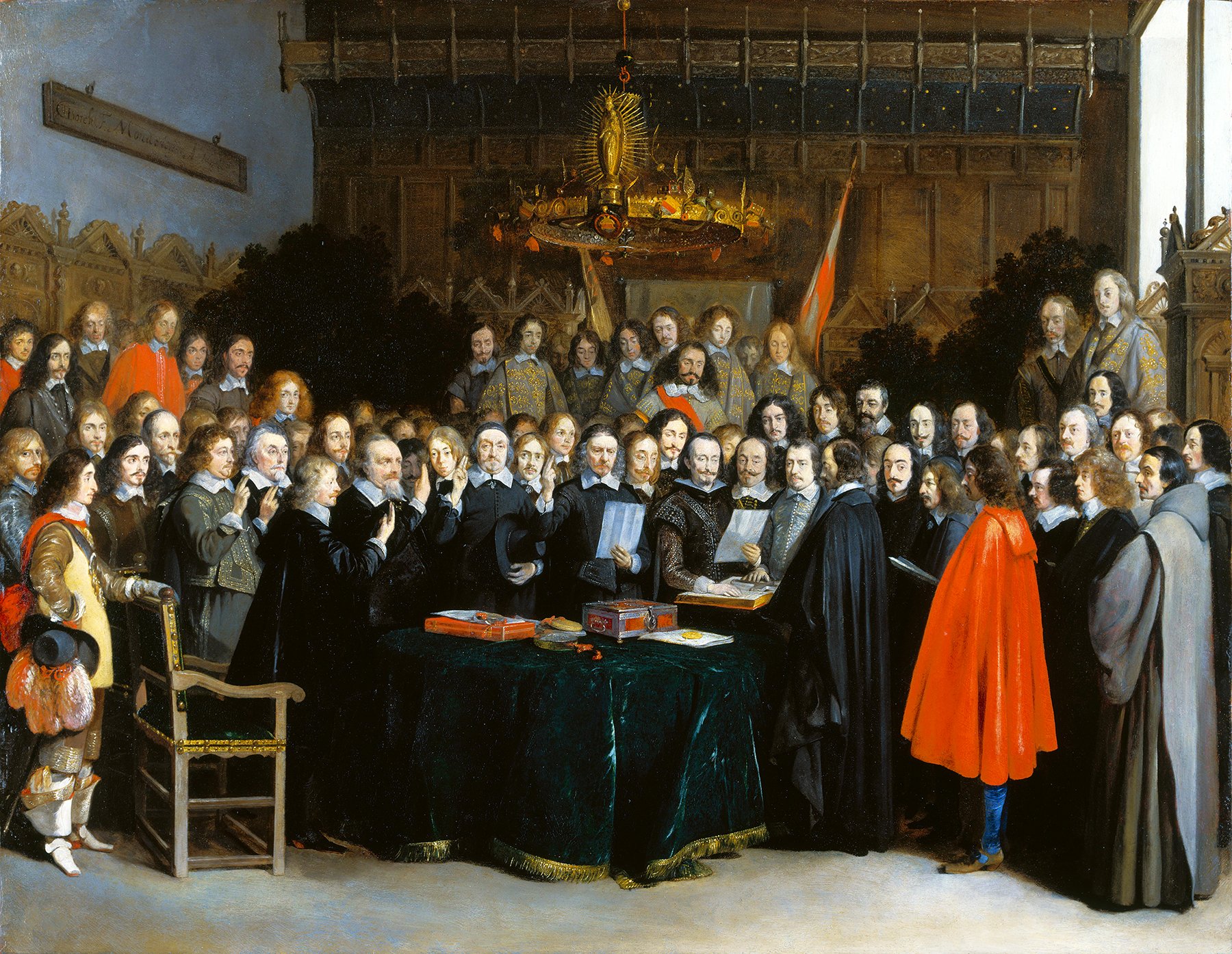 A detailed painting depicting the Ratification of the Spanish-Dutch Treaty of Münster on 15 May 1648. A large assembly of dignitaries, diplomats, and officials gather in a grand room with intricate woodwork and chandeliers. Central to the scene is a table draped in green cloth, where documents await ratification. Several figures are engaged in discussion or reading, while others solemnly observe. Two prominently dressed figures, one in a vibrant red cloak and another in an ornate armor, stand out among the gathering. The atmosphere is one of solemnity and significance, capturing the historic moment of treaty ratification.