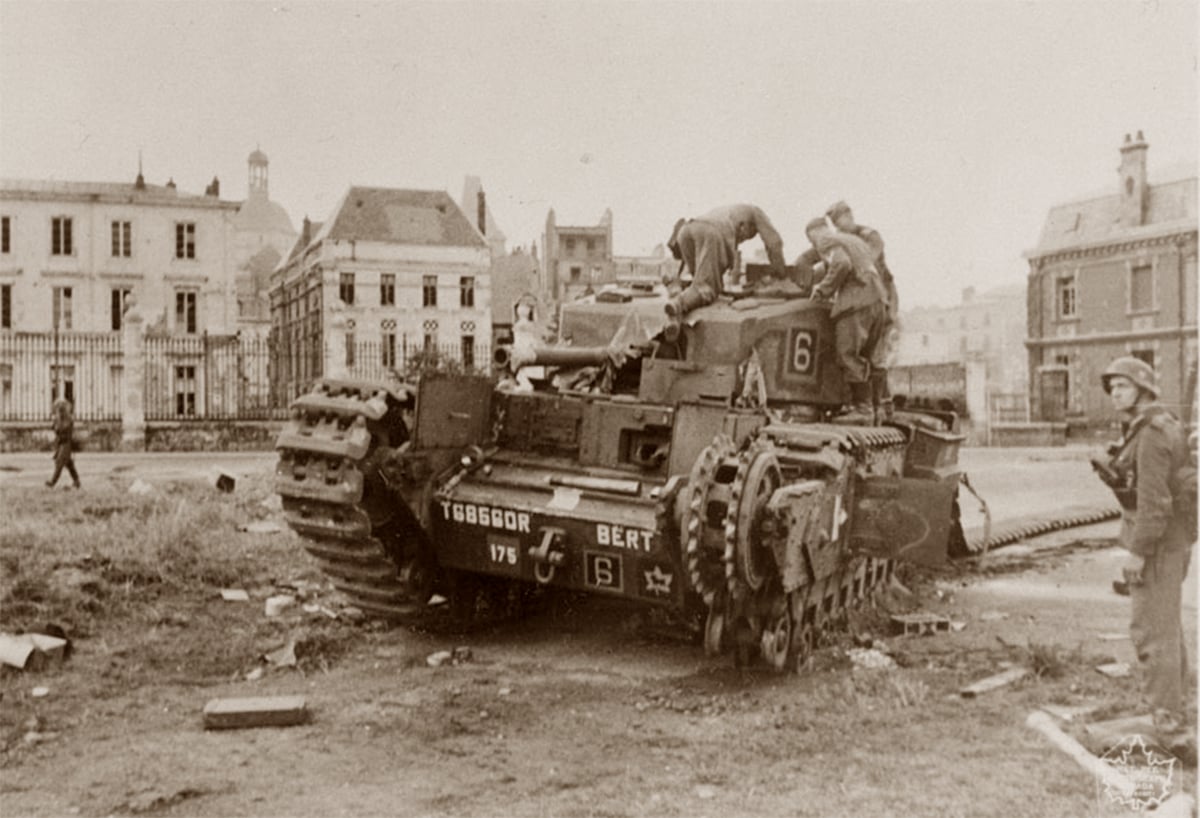 Sepia-toned historical photo showing German troops inspecting an abandoned "Churchill" tank, marked with the number 6, from the Calgary Regiment in the aftermath of the Dieppe raid, amidst war-damaged urban surroundings.