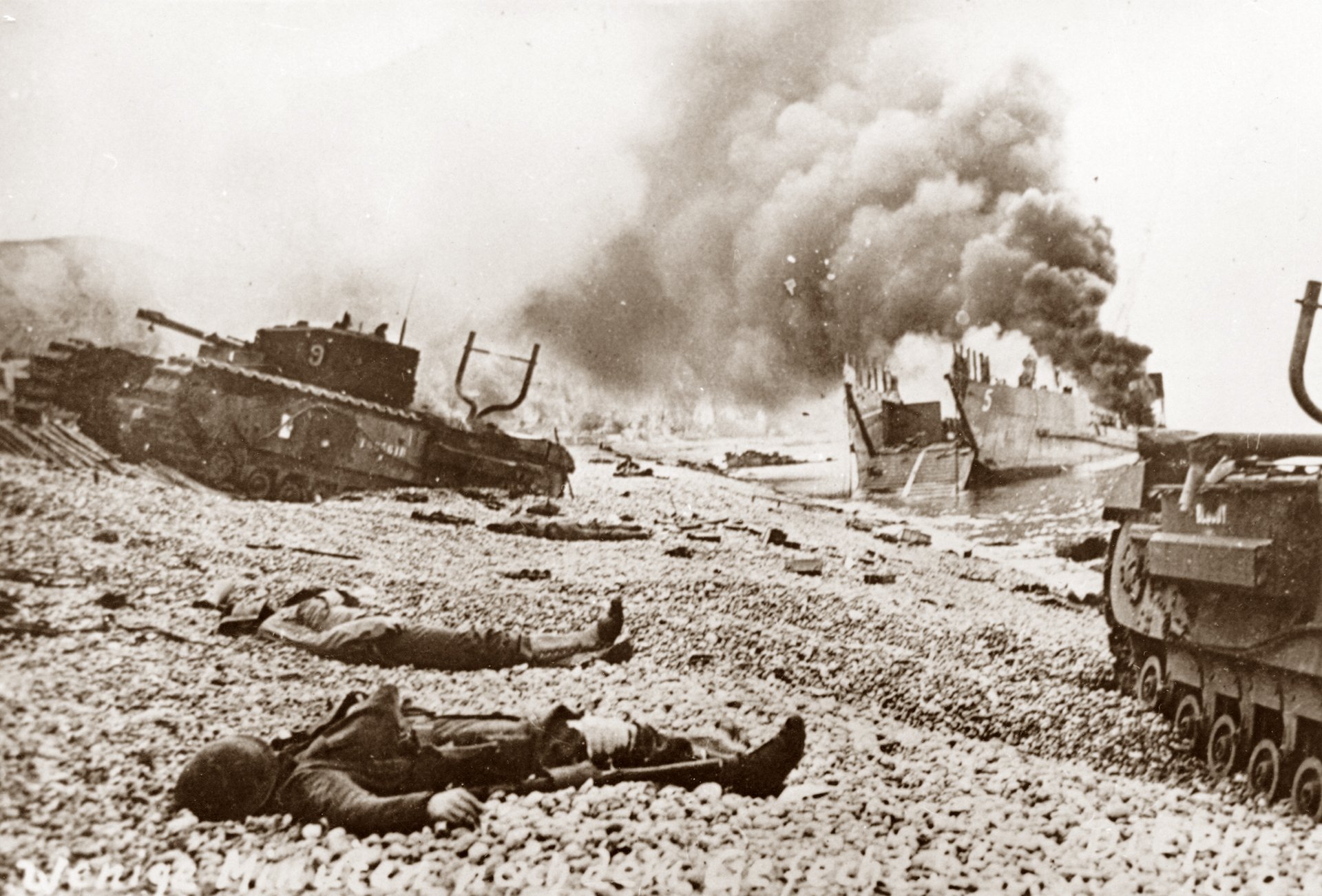 A Landing Craft, Tank (LCT) TLC5 No. 121 aflame near the shore following the Allied raid, primarily involving Canadian forces, against German defences. Images depict Churchill tanks and fallen Allied servicemen on the beach, with one tank on the left belonging to 9 Troop, 14th Army Tank Battalion (The Calgary Regiment (Tank)), carried by TLC5 on 19 August 1942.
