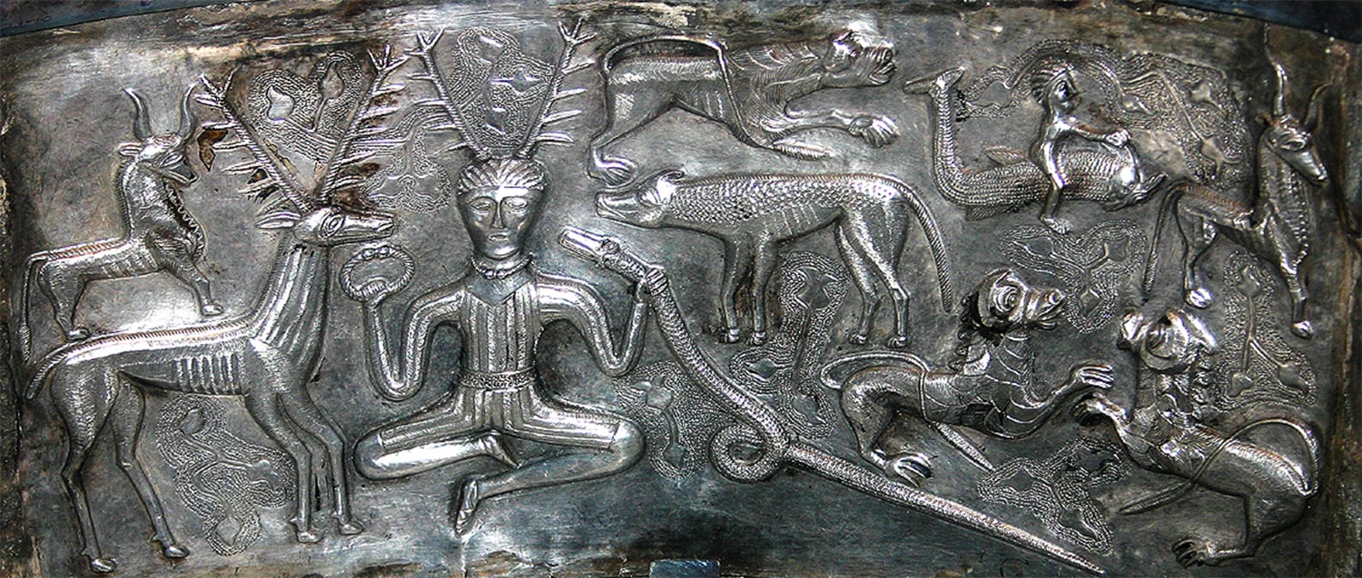 A detailed engraving from the Gundestrup Cauldron depicting a central figure, possibly a deity or shaman, surrounded by various animals, including a stag, a serpent, and other creatures, showcasing intricate Celtic artistry.