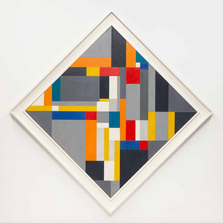 "Grey Diamond" by Ilya Bolotowsky, 1955, a geometric abstract painting with a diamond-shaped frame and a complex arrangement of overlapping rectangles and squares in grey, blue, yellow, orange, red, and white.