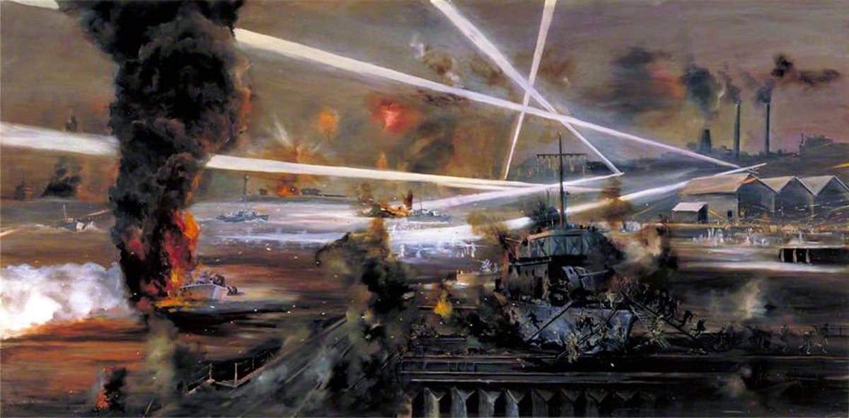 A dramatic painting by John Alan Hamilton depicting the Raid on St Nazaire, which occurred between 27–28 March 1942. The artwork shows a chaotic night scene illuminated by bright searchlights crisscrossing the sky, with explosions and billowing smoke. Ships and commandos are engaged in the operation, with firefights visible on the water and among the dock installations. The atmosphere is tense and action-packed, capturing the intensity of the historic battle.