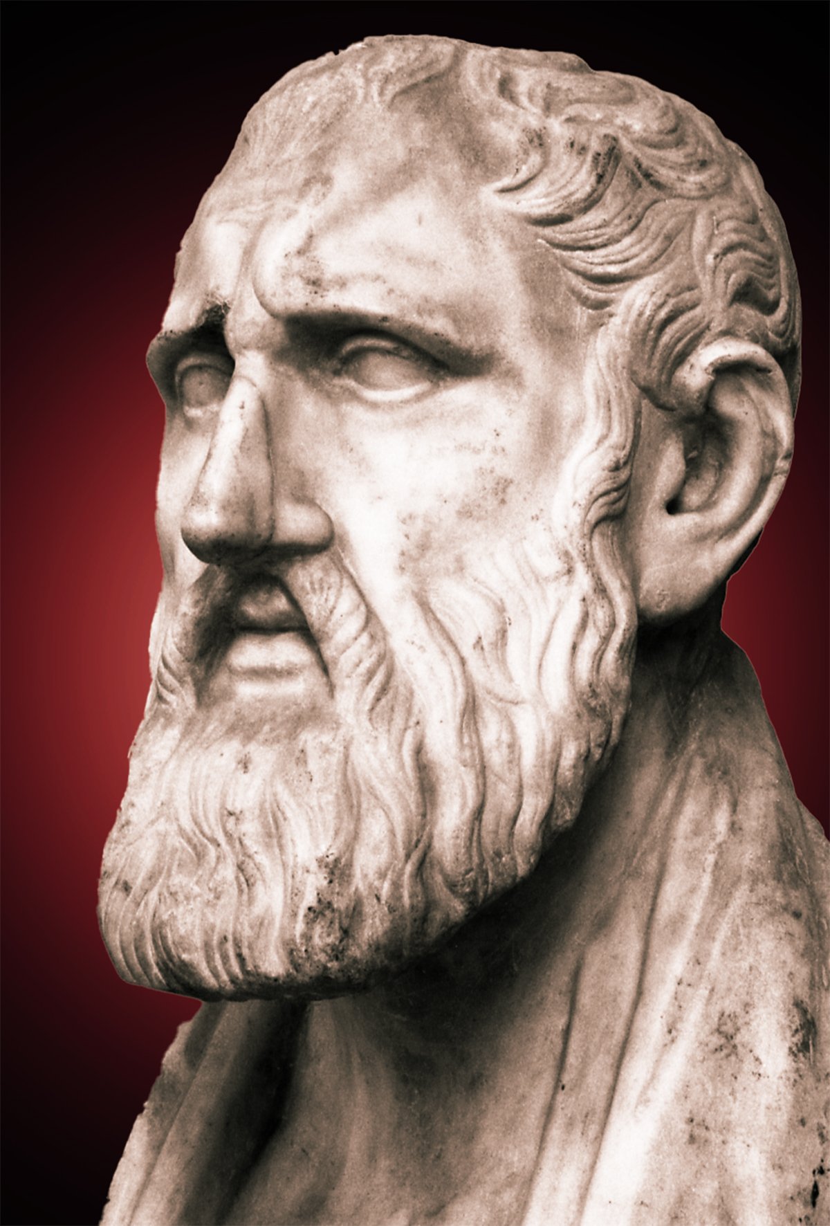 Bust of a stern-looking bearded man, Greek Philosopher Zeno, with deep-set eyes and a prominent brow. The sculpture shows fine details in the hair and beard, suggesting a figure of wisdom or contemplation. The bust is set against a red background that fades into shadows at the edges, drawing focus to the facial features.